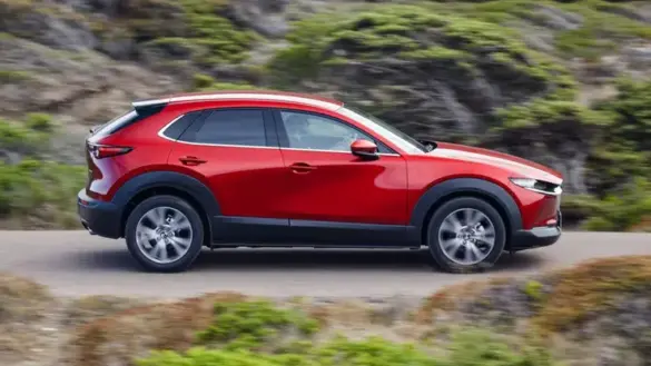2023-mazda-cx-30-red-driving-profile-right