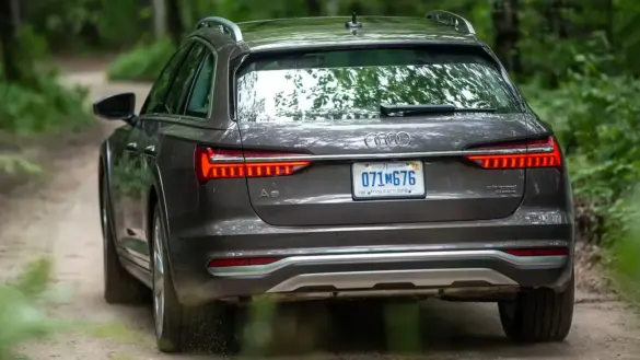 gray-audi-a6-allroad-driving-rear-leftish